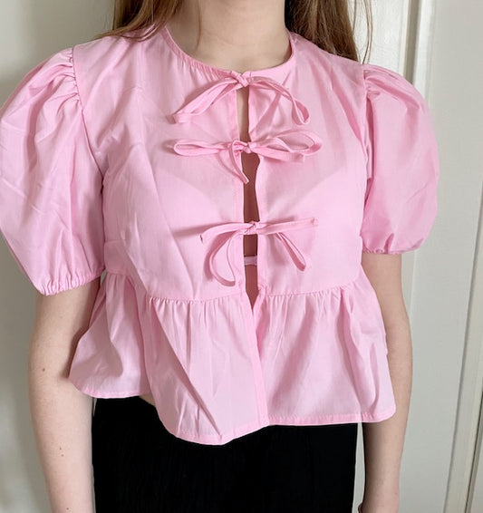 Roze strikjes blouse